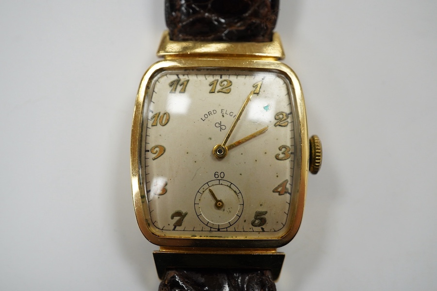 A gentleman's 14k Lord Elgin manual wind wrist watch, with Arabic dial and subsidiary seconds, case diameter 25mm, on an associated leather strap. Condition - poor